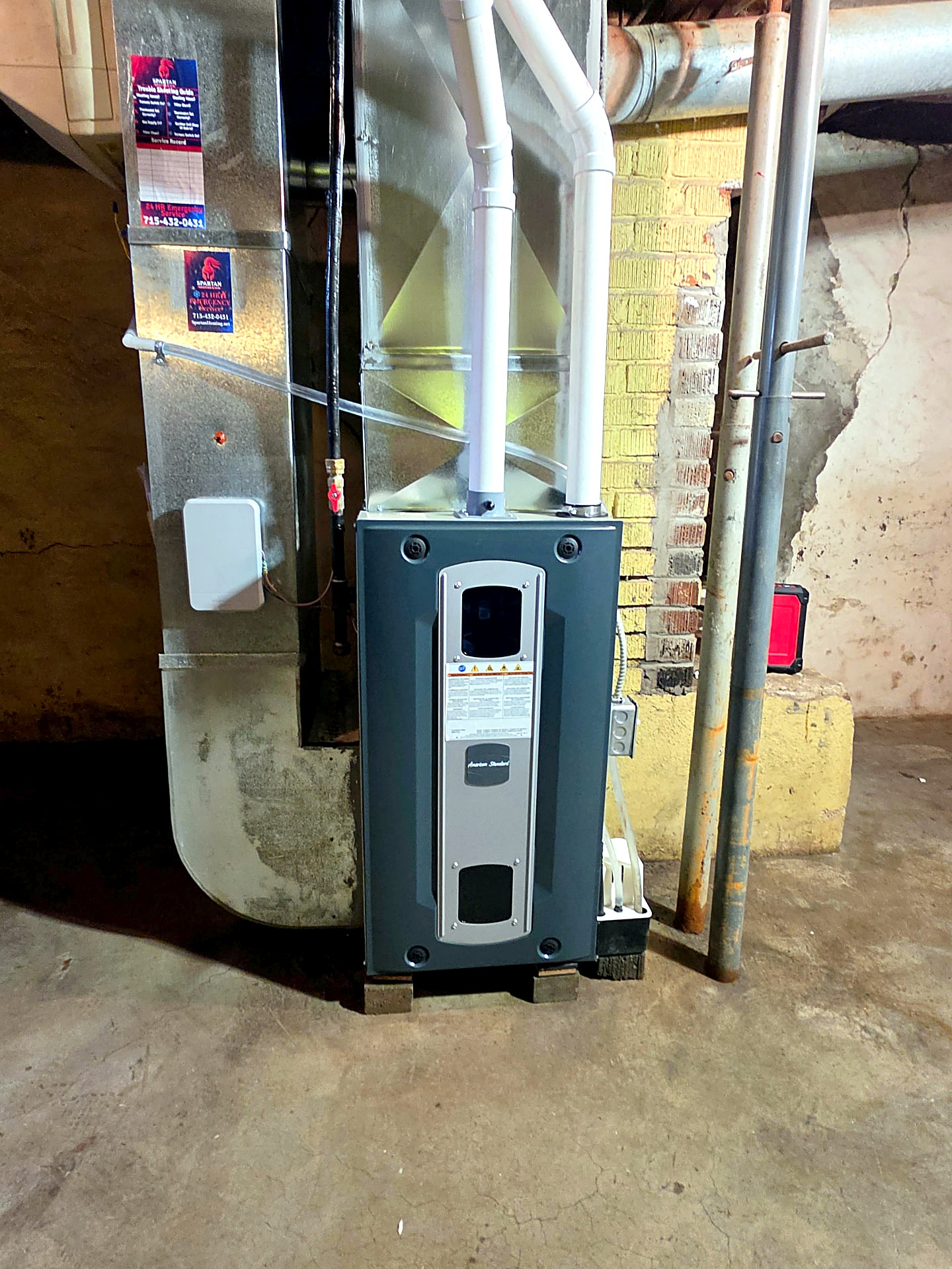 American Standard gas furnace installation with PVC venting and sheet metal ductwork